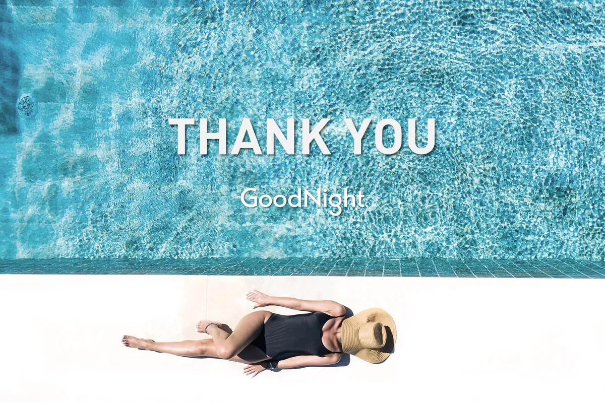 A tranquil exterior scene featuring a sparkling swimming pool at sunset, with a person leisurely lounging poolside. The pool area exudes a sense of luxury and relaxation, offering inviting waters for swimming and a serene environment for unwinding under the stars.