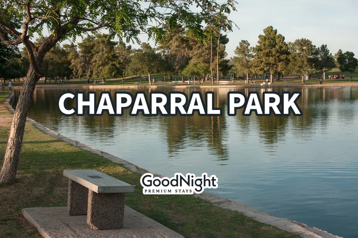 A tranquil exterior park scene with calm water, a park bench, and a tree line, evoking a peaceful setting ideal for relaxing strolls, picnics, and bird watching.