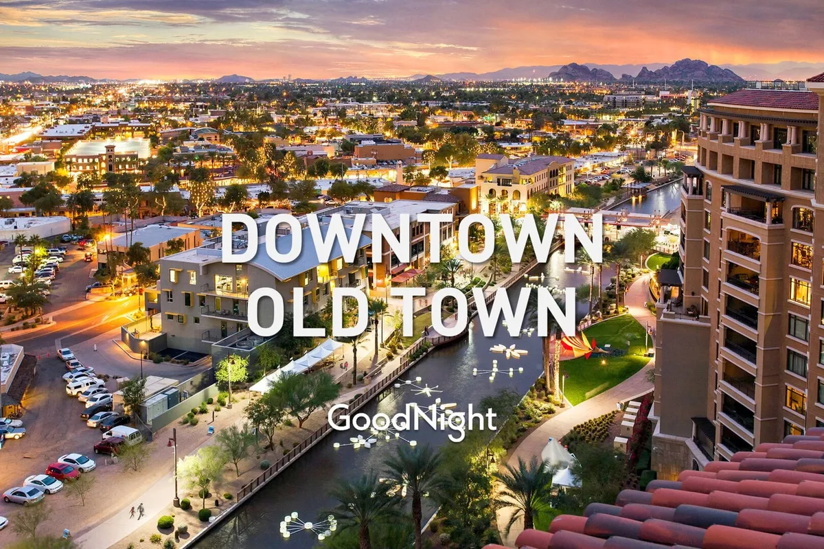 A scenic city view capturing the Old Town skyline with palm trees, a shimmering waterway, and street lighting. The vibrant urban environment hints at a variety of outdoor activities and bustling local experiences, especially during the evening.